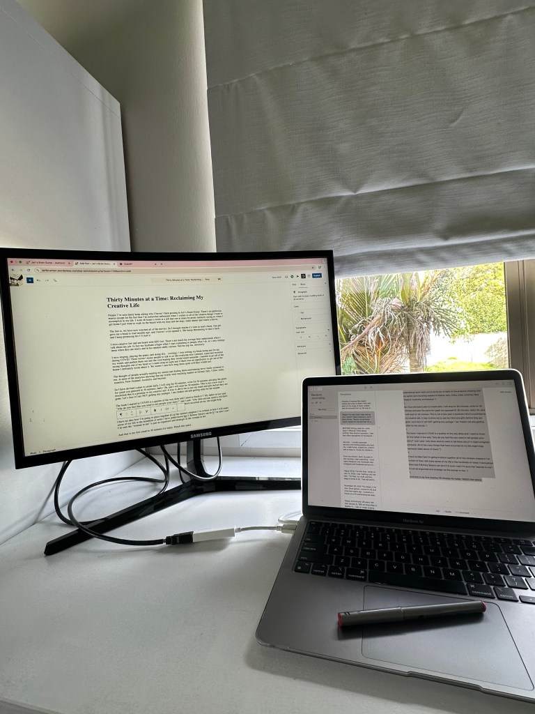 Jeri's Brain Dump office and writing tools. A computer and monitor on the desk.
